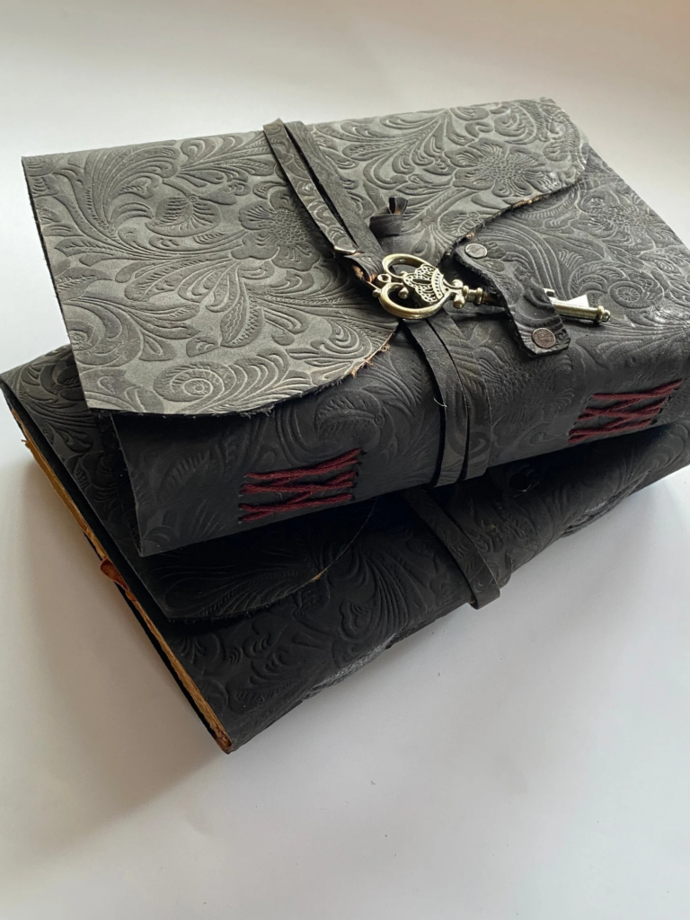 beautifully designed leather journal example pressed paisley with strap and key